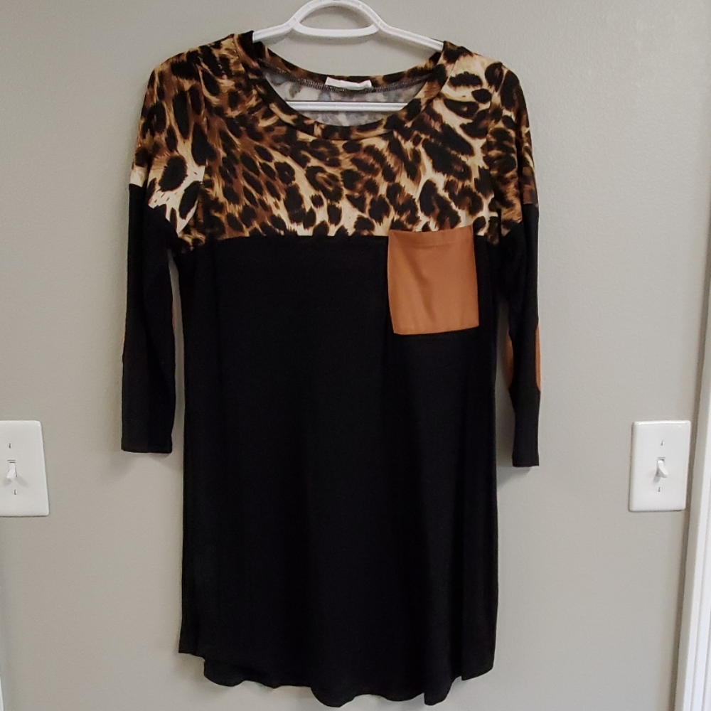 Women's leopard/black tunic with arm patches.